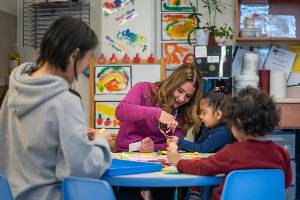 Melinda French Gates frequently visits nonprofits around the country. Here she is making crafts with children at the El Centro de la Raza headquarters in Seattle, Washington.PHOTO BY JOVELLE TOMAYO, COURTESY PIVOTAL VENTURES