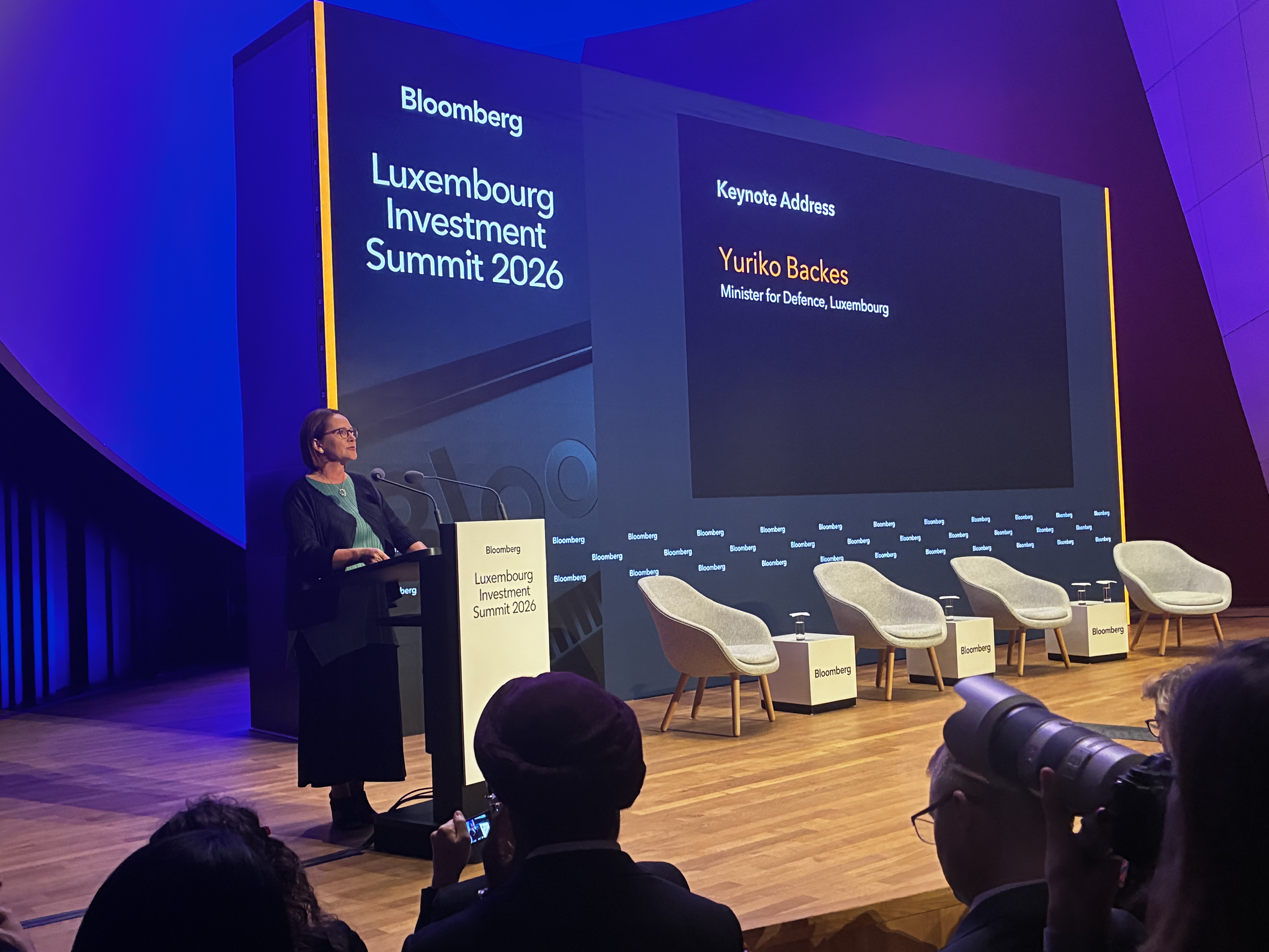 (Minister of Defence, Yuriko Backes, during her keynote address at the Bloomberg Luxembourg Investment Summit 2026. Photo © Forbes Luxembourg)